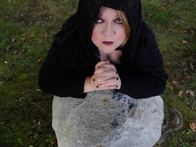 goth girl kneeling in prayer